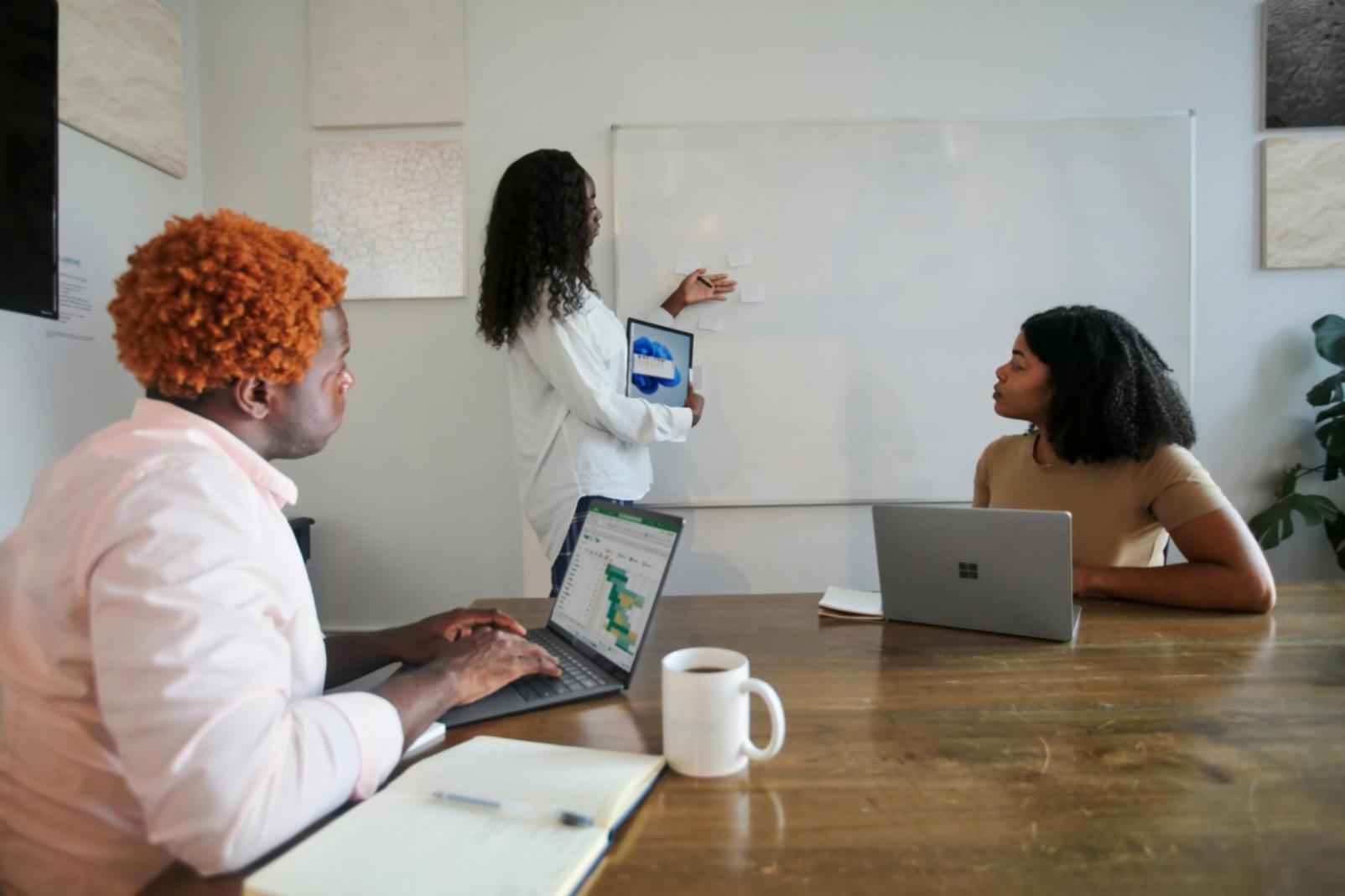 Financial analyst reviewing budget presentation materials and charts