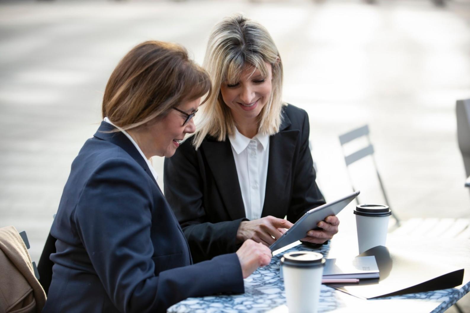 Professional demonstrating remote budget presentation techniques with multiple screens and interactive tools
